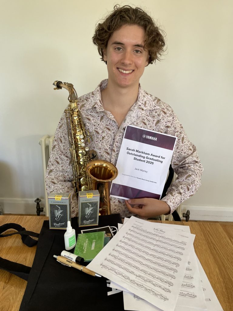 Jack Marley with gifts from Yamaha, Vandoren, Saxtet